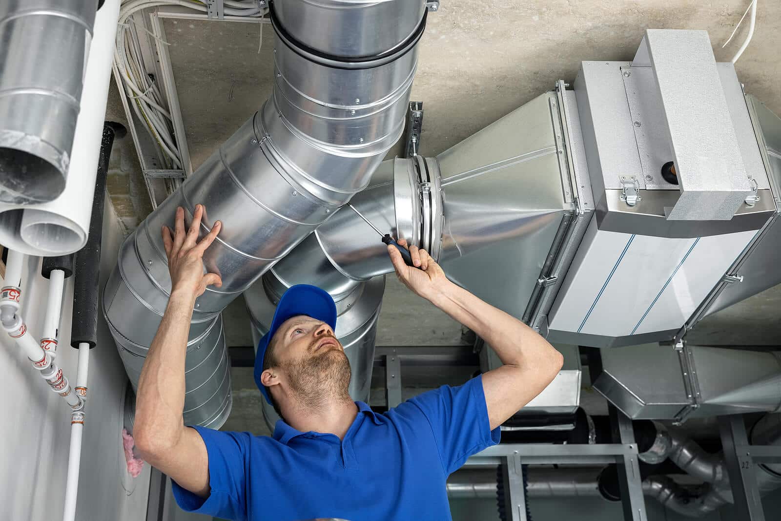HVAC technician inspecting and repairing air ducts in Palo Alto