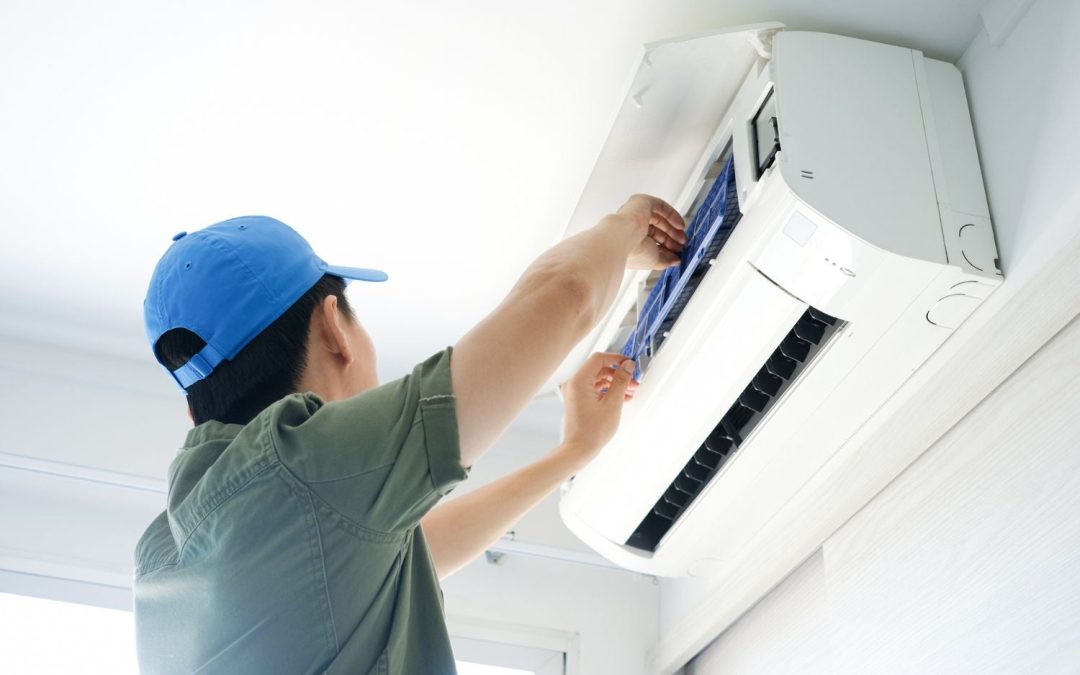 HVAC technician servicing a ductless mini split in Palo Alto