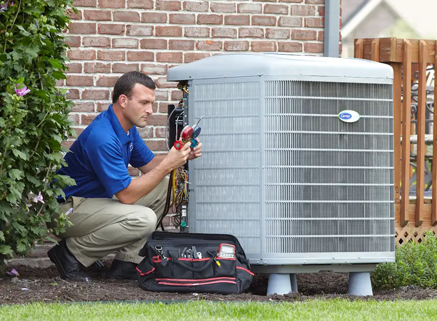 HVAC technician inspecting an outdoor AC unit in Palo Alto