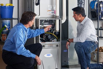 Furnace Repair or Replacement Palo Alto Technician evaluating a furnace for repair or replacement in Palo Alto