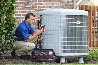 Outdoor AC Unit Inspection Palo Alto HVAC technician inspecting an outdoor AC unit in Palo Alto